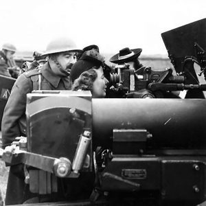 Munitions workers fire guns at a Royal Artillery Camp